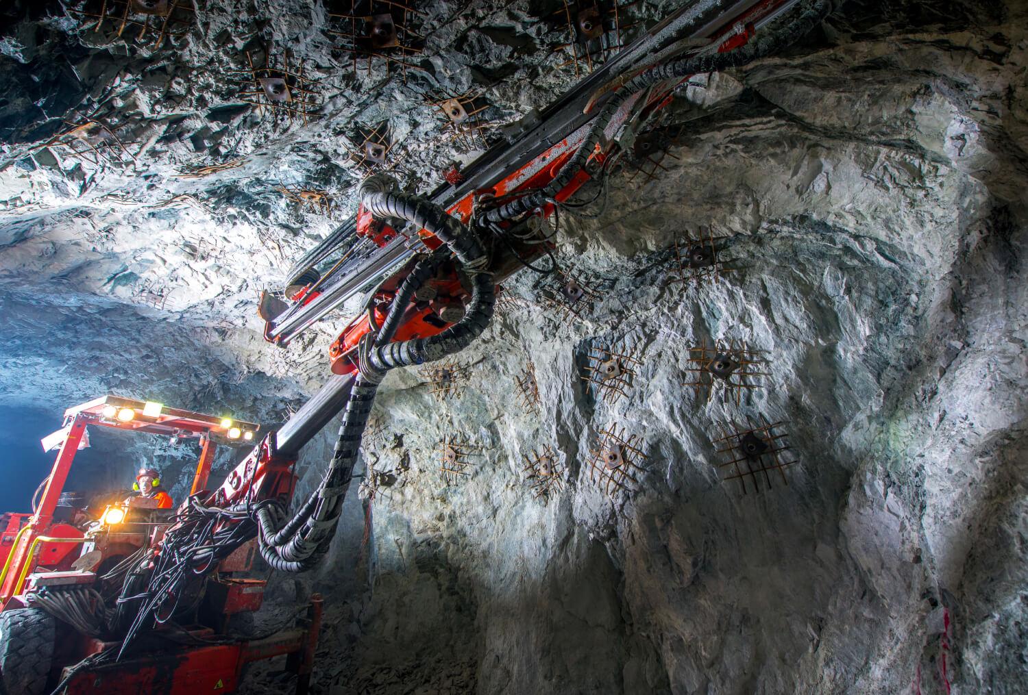 Underground Mine with staff using machinery